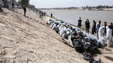 cleaning mud Iraq|Iraqis Clean up River as First Green Projects Take Root.